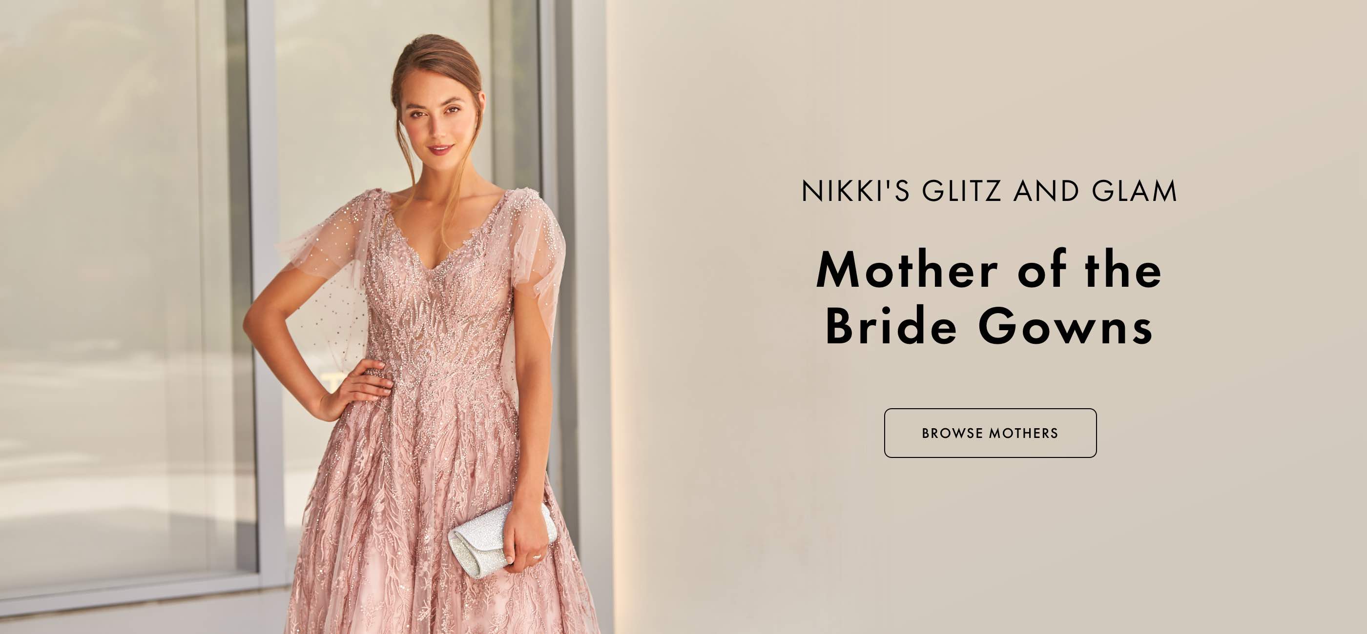 Woman in a blush pink mother of the bride gown
